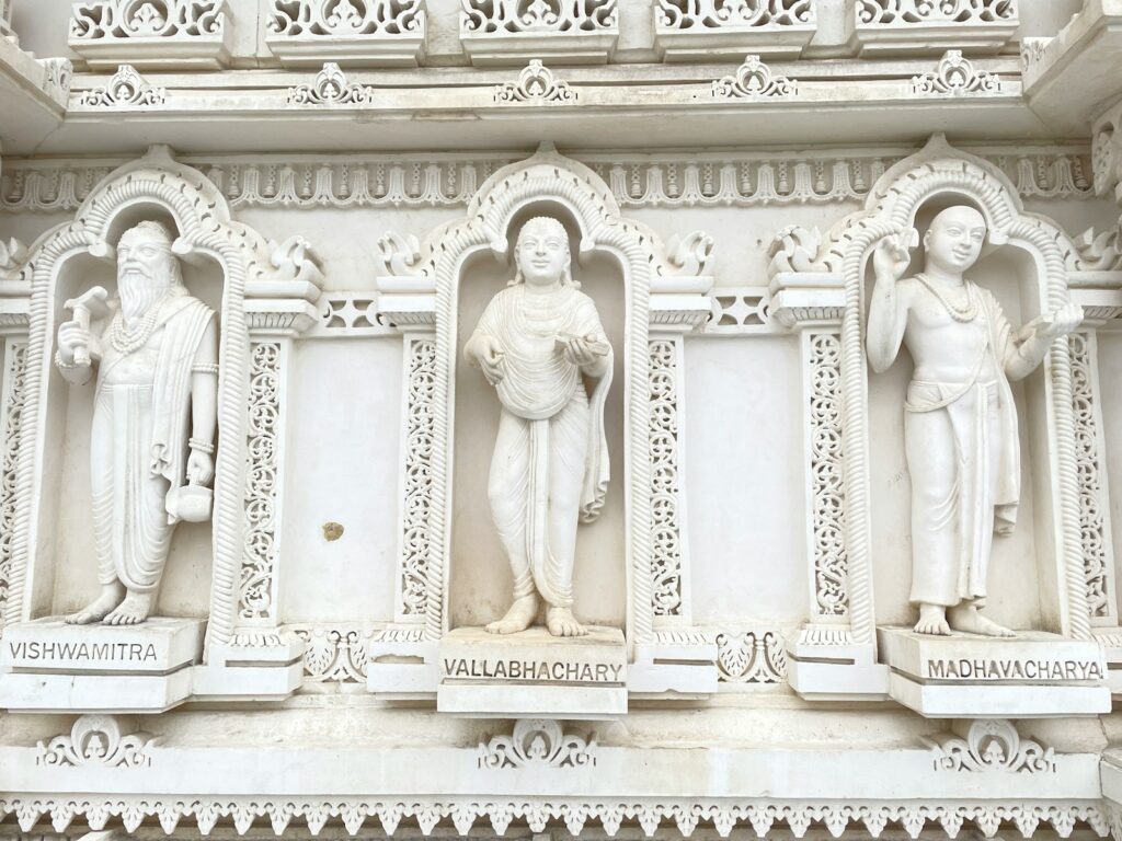 a group of statues on the side of a building