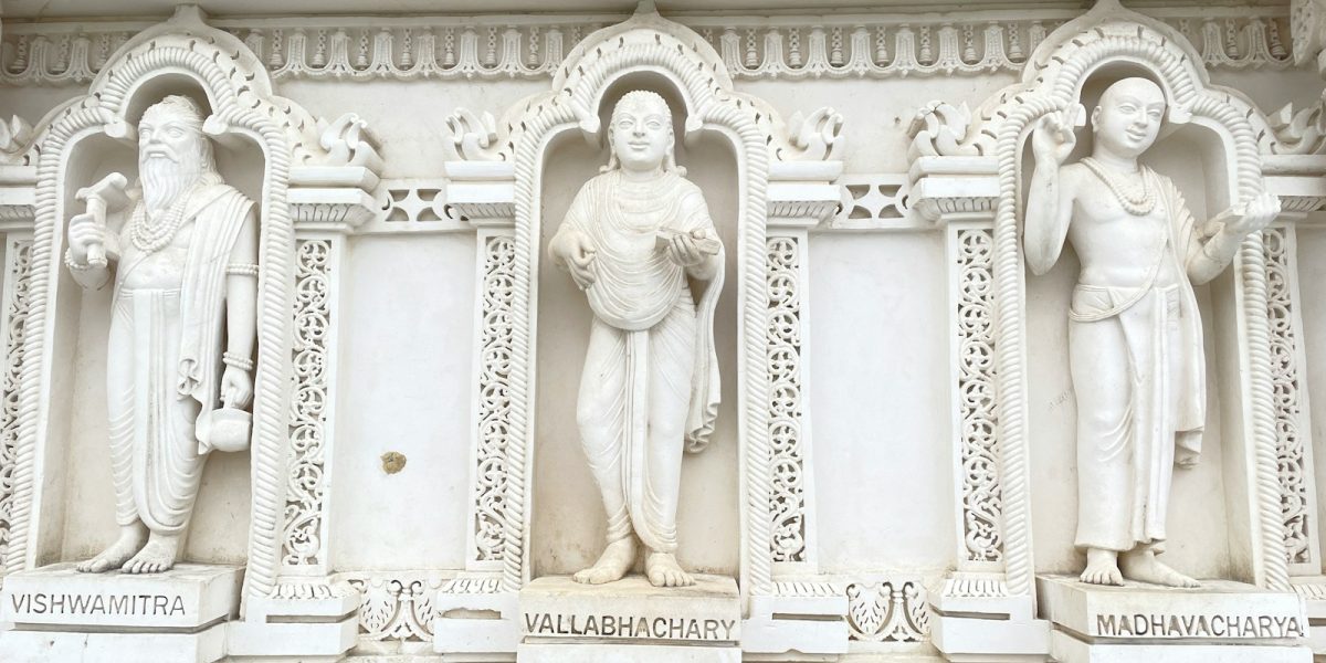 a group of statues on the side of a building